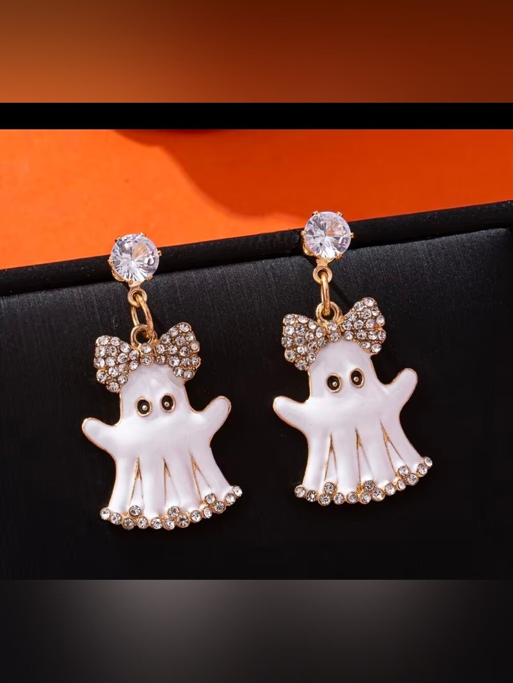 Gold-Tone White Ghost Drop Earrings with Crystal Bow Accents